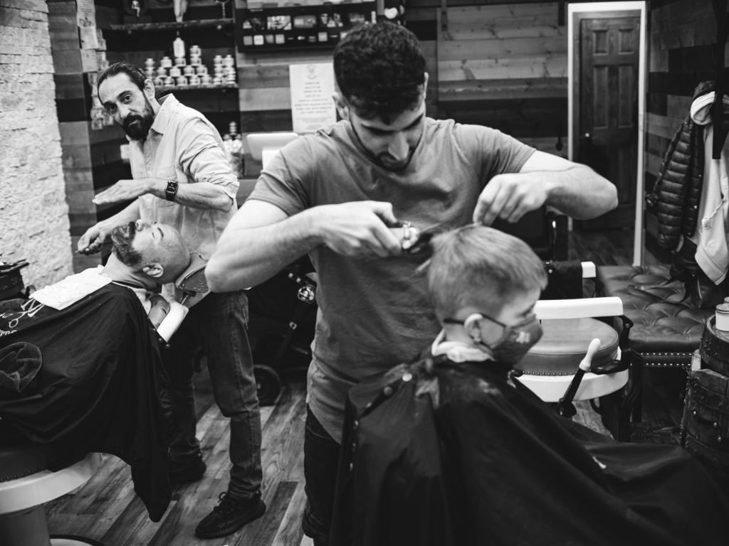 How can barbers ensure that their disinfectant jars are effectively killing bacteria and germs?